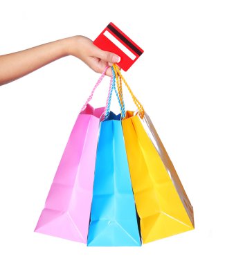 Female Hand Holding Colorful Shopping Bags and Credit Card