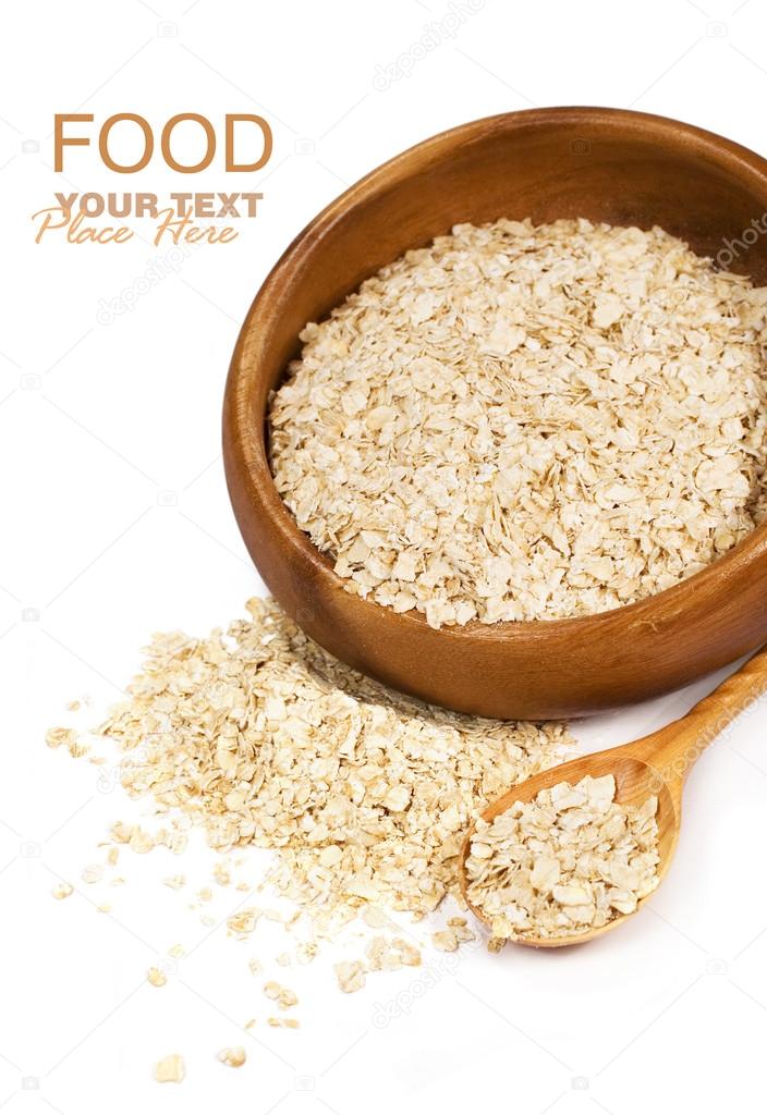 Oat flakes in wooden bowl