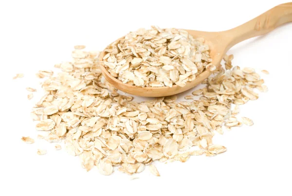 Avena en una cuchara de madera — Foto de Stock