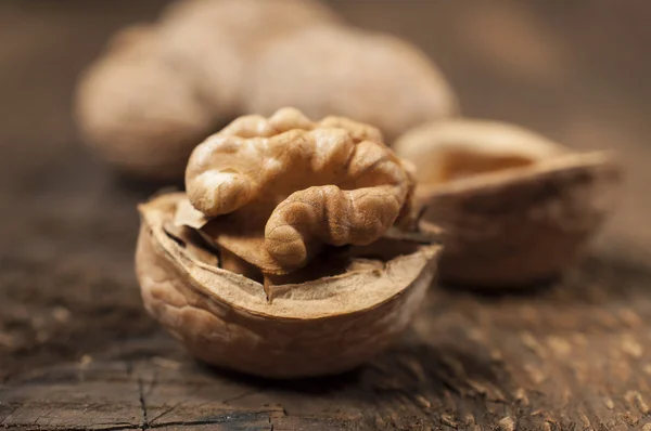 Walnuts on a wooden texture — Stock Photo, Image
