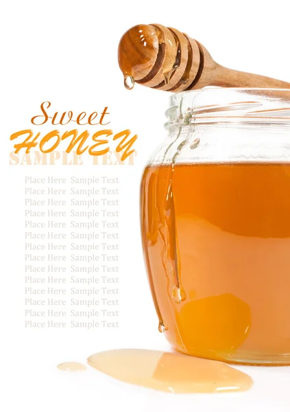 Miel en el frasco de vidrio — Foto de Stock