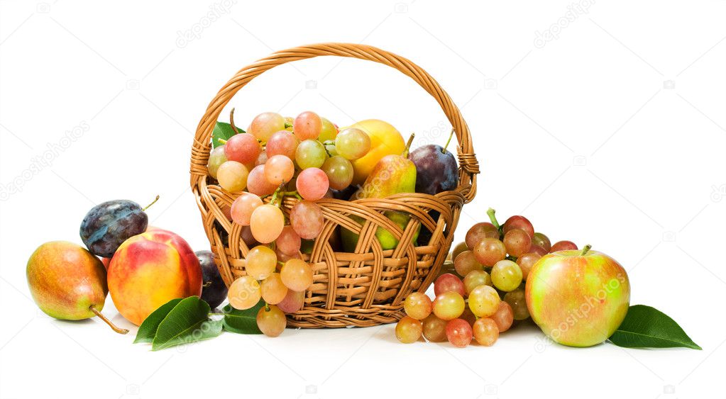 Harvest. assortment of fruit in a basket isolated on white