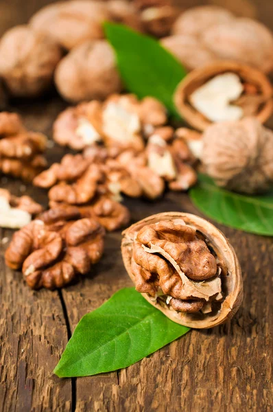 Walnuts with green leaves — Stock Photo, Image