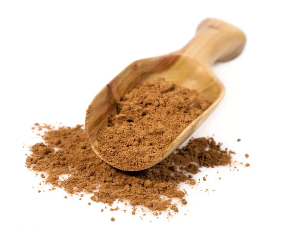 Cocoa powder in a wooden scoop — Stock Photo, Image