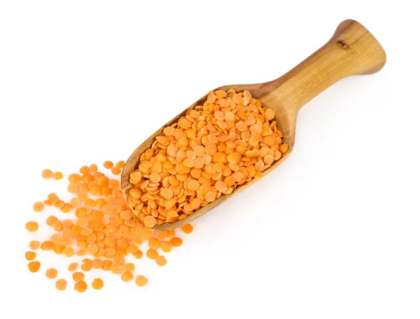 Yellow lentils in a wooden scoop — Stock Photo, Image