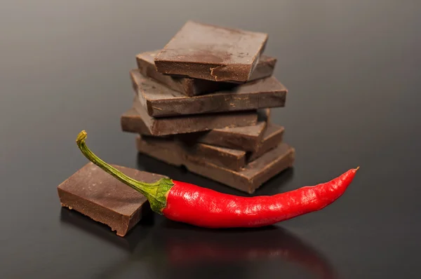 Black chocolate with red hot pepper — Stock Photo, Image