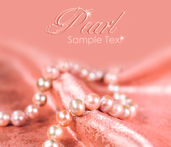 pearl necklace on a pink silk