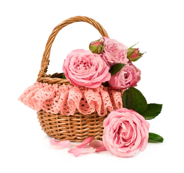 Pink roses in a wicker basket with lace — Stock Photo, Image