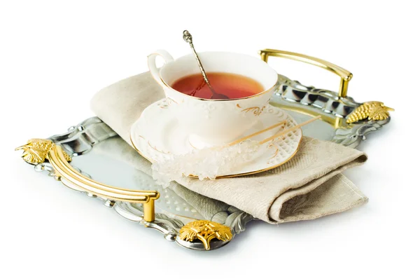 优雅的茶杯放在托盘用糖插到棍子上 — 图库照片