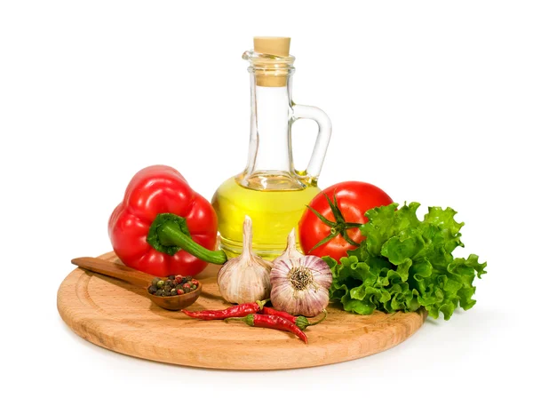 Fresh vegetables , spices and olive oil in a bottle — Stock Photo, Image