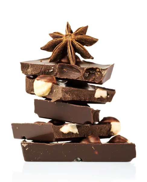 Black chocolate with nuts and star anise — Stock Photo, Image