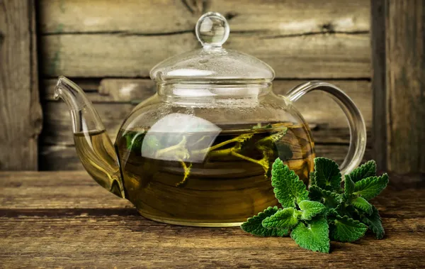 Mint tea in glass teapot — Stock Photo, Image
