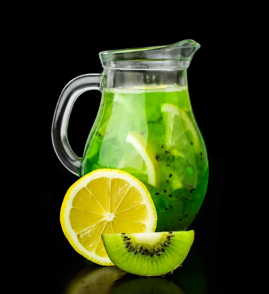 Drink with kiwi and lemon in a glass jug — Stock Photo, Image