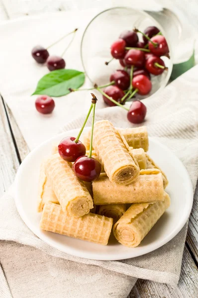 Sweet wafer rolls with cherries — Stock Photo, Image