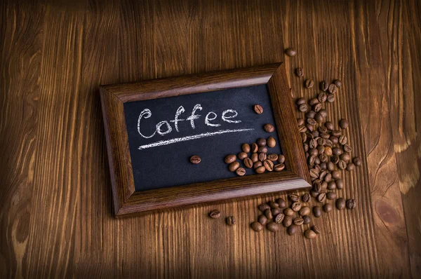 Slate with coffee beans — Stock Photo, Image