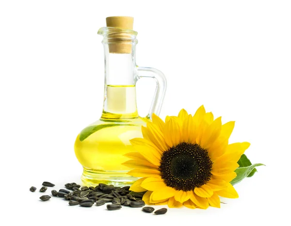 Oil with sunflower seeds and isolated on white — Stock Photo, Image