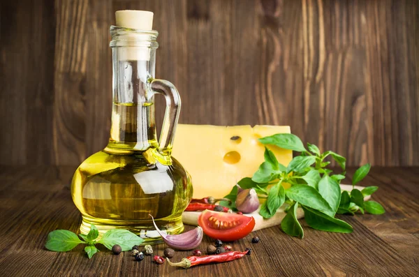 Olive oil with cheese, basil and spices on a wooden — Stock Photo, Image