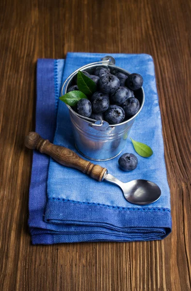 Blueberries in small bucket — Stock Photo, Image