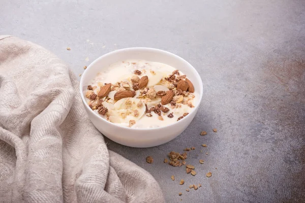 Granola Yogurt Fresh Banana Almond Nuts Healthy Breakfast Grey Concrete — стоковое фото