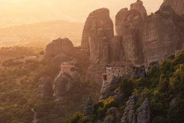 Beautiful sunset landscape with amazing old monasteries of Meteora, Kalabaka, Greece
