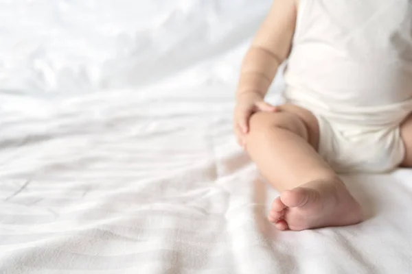 Cute Little Baby Sitting White Bed Bedroom Selective Focus Space — Stock fotografie