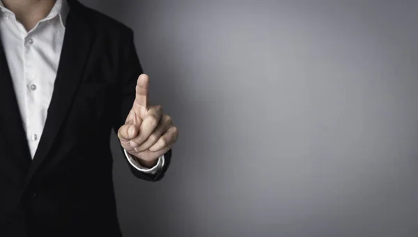 Businessman pointing his finger. Business man hand touching virtual screen, modern background concept with copy space.