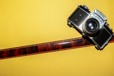 Camera and tape for a picture. Background and camera. Design for a photo studio