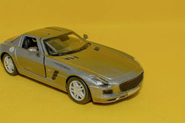 Sports car on a yellow background. Car mockup for designers