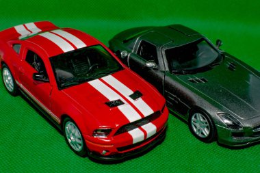 Beautiful cars on a green background. Sports cars