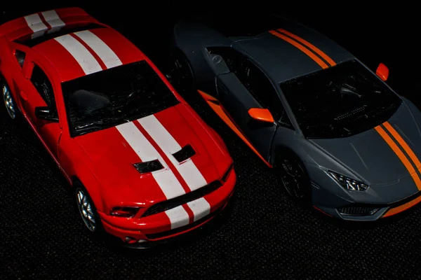 Two sports cars in salon. Nice auto. Need for speed