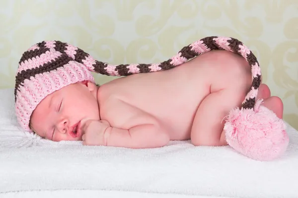 Newborn baby with pompom hat — Stock Photo, Image