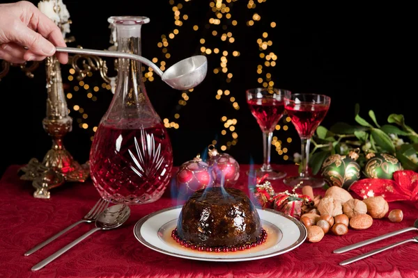 Lighting the plum pudding — Stock Photo, Image