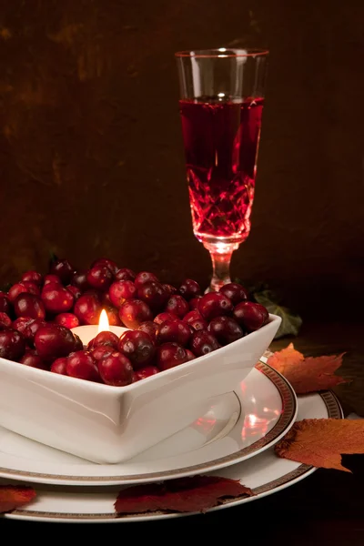 Thanksgiving dinner table with cranberries — Stock Photo, Image