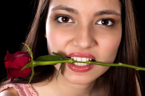 Red rose in her mouth — Stock Photo, Image