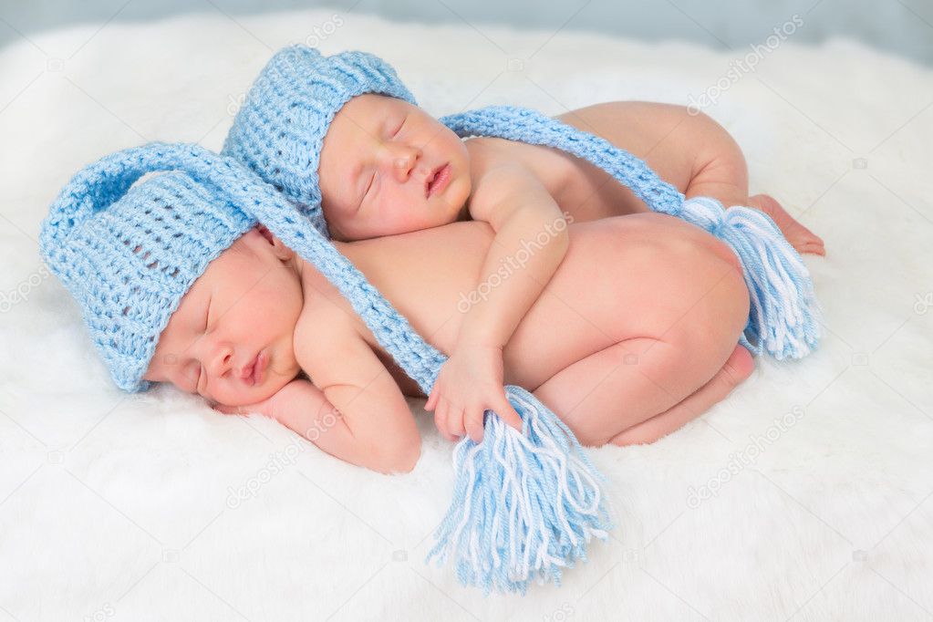 Twins in blue hats
