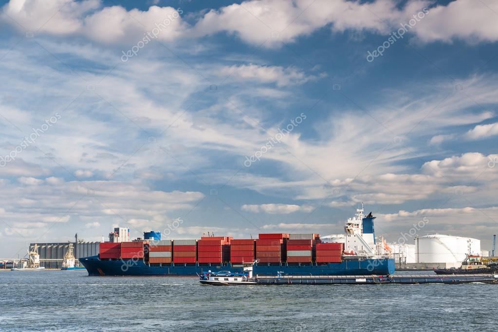 Large container ship entering Antwerp harbor - all brands and logos have been removed
