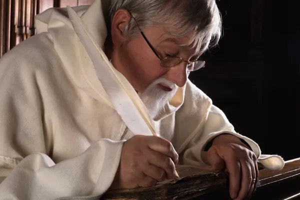 Ancient book and monk — Stock Photo, Image