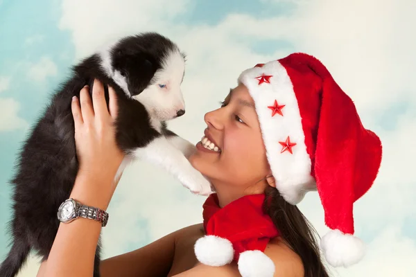 Köpek ve Noel Baba kız — Stok fotoğraf
