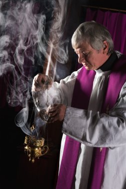 Incense burner and priest clipart