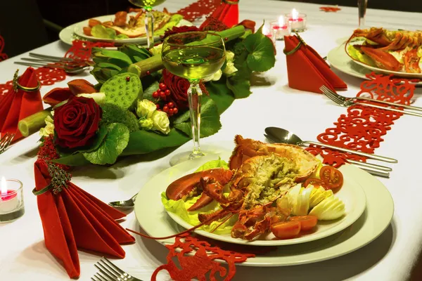 Ornate christmas dinner with lobster — Stock Photo, Image