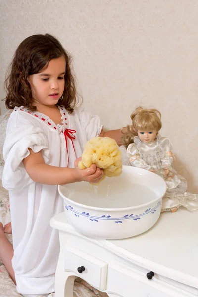 Vintage girl washing doll — Stock Photo, Image