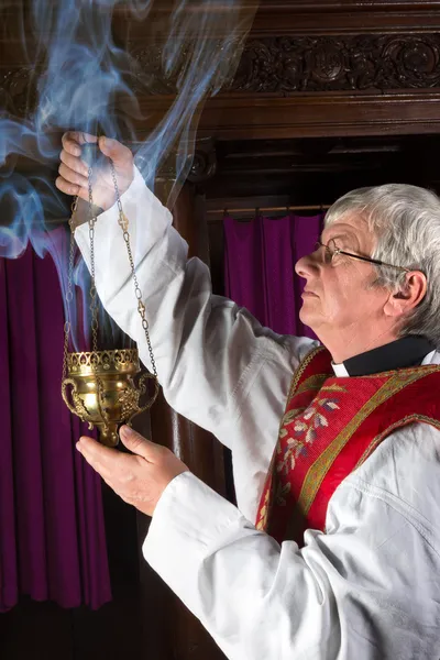 Priest with incense burner — Stock Photo, Image