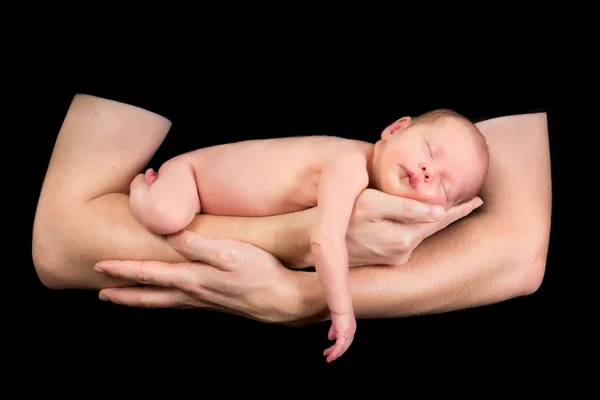 Slapende baby in de armen van de vader — Stockfoto