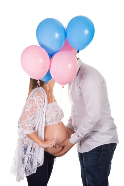 Kissing pregnant couple — Stock Photo, Image