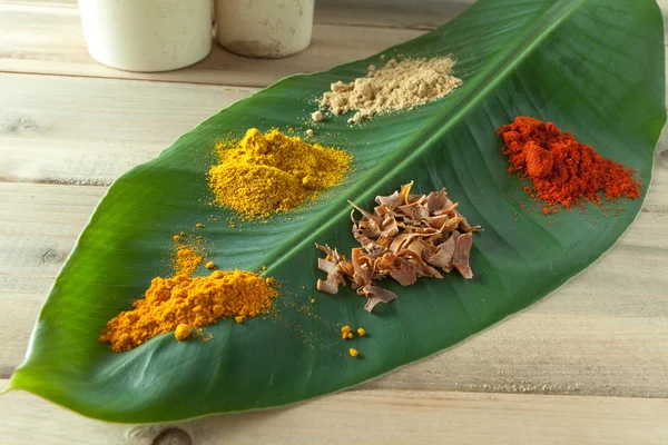 Banana leaf with colorful spices — Stock Photo, Image