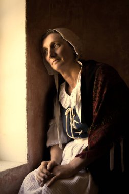 Penceresinde oturan bir kadının Vermeer ya da Rembrandt tarzı portresi