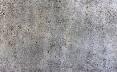 Beton duvar dokusu. Yüzeyinde boya olan eski çatlak bina arka planı