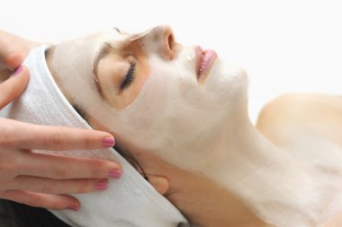 facial mask in a day spa clipart
