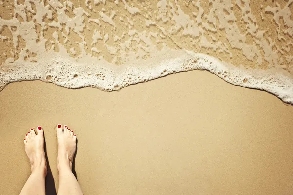 Ноги на пляжі Стокове Зображення