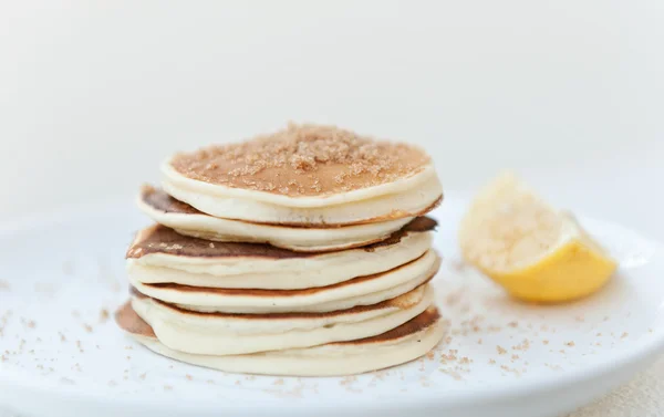 Front view pancakes with brown sugar and lemon — Stock Photo, Image